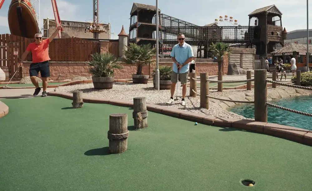 Families playing Pirate Island Adventure Golf